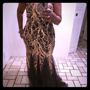 Black and gold sequins dress.